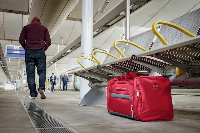 Suspicious Bag Left by the Red Hooded Man